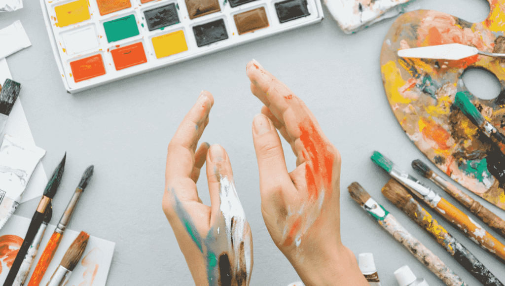 An individual engaging in art therapy, using creativity for healing and emotional expression.